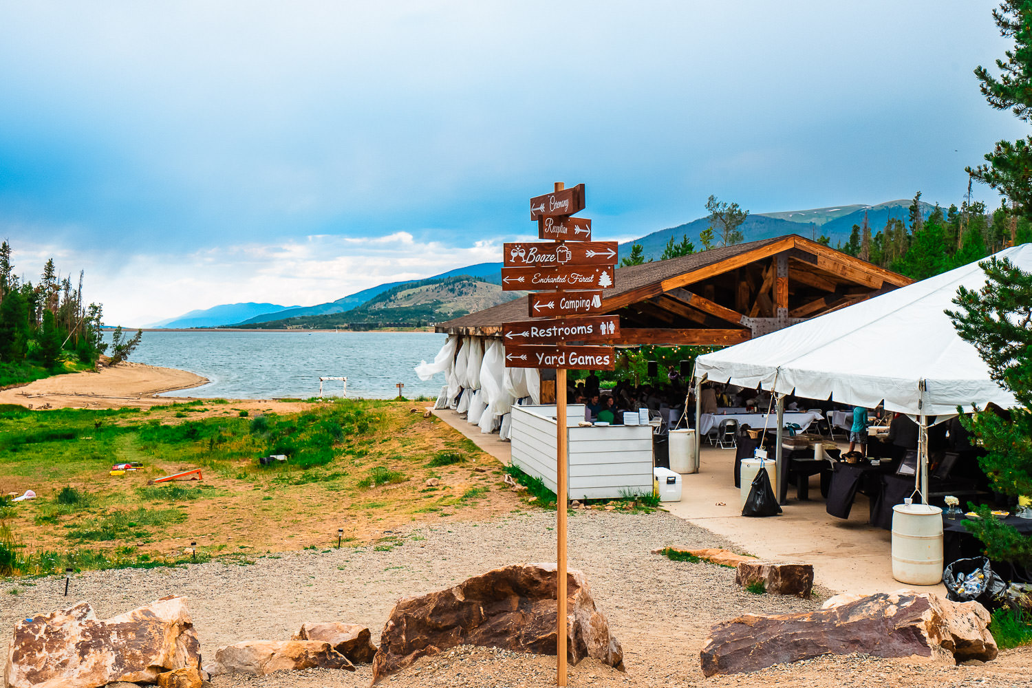 Guests gather beneath the covered Group Shelter nonelectric during a Windy Point Campground Wedding on Lake Dillon near Keystone, Colorado.