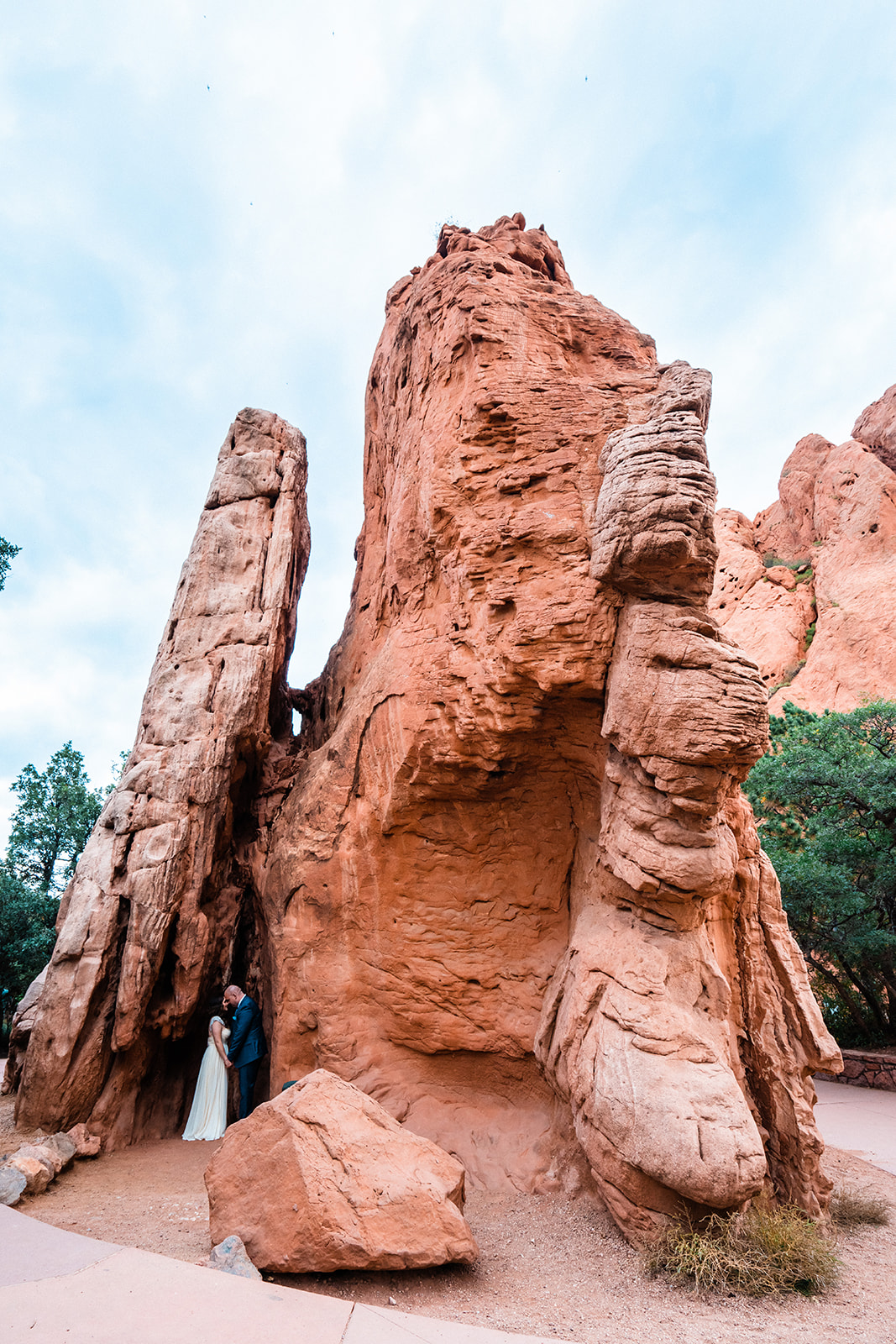 Newlyweds embrace in Sentinel Plaza during their Garden of the Gods elopement.